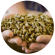 A farmer's hands holding animal feed