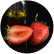 Flavors in glass bottles with fruits beside them