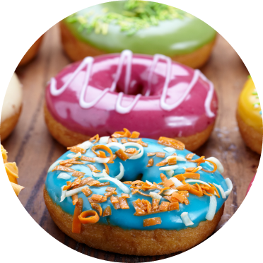 Donuts with a variety of brightly colored icings