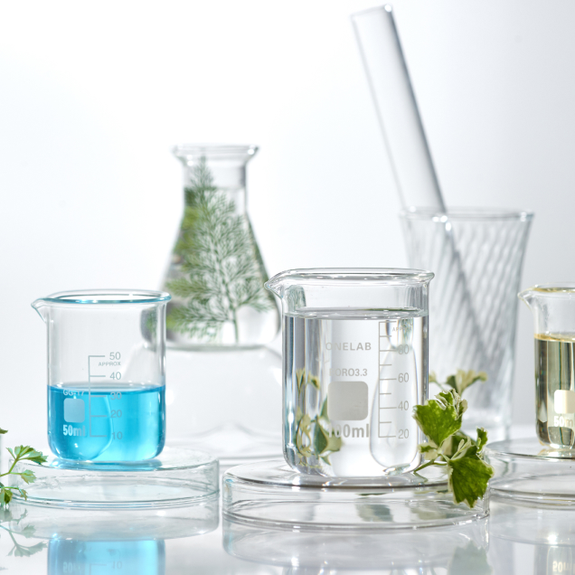 A shot of glass beakers filled with liquid
