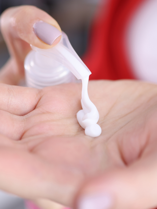 A close-up of someone using lotion
