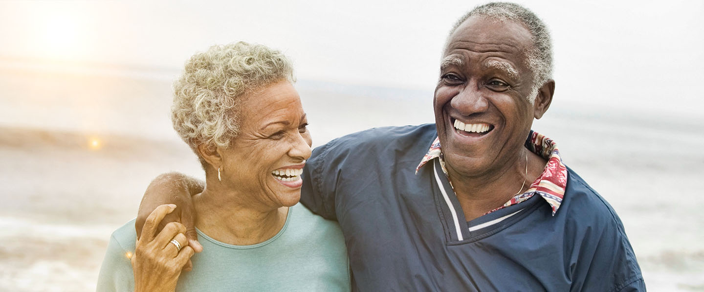 Happy senior african american couple at the beach