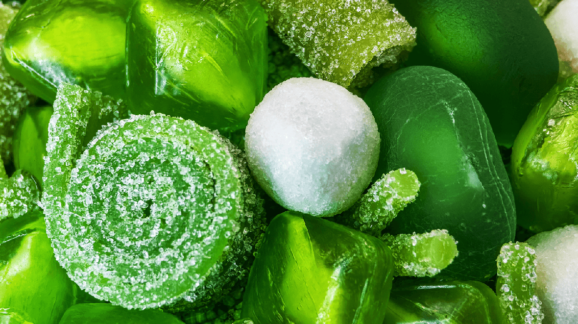 Colorful assortment of green candies displayed together