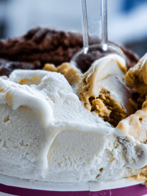 Closeup of a tub of nougat and chocolate ice cream enhanced by emulsifiers for a creamy mouthfeel