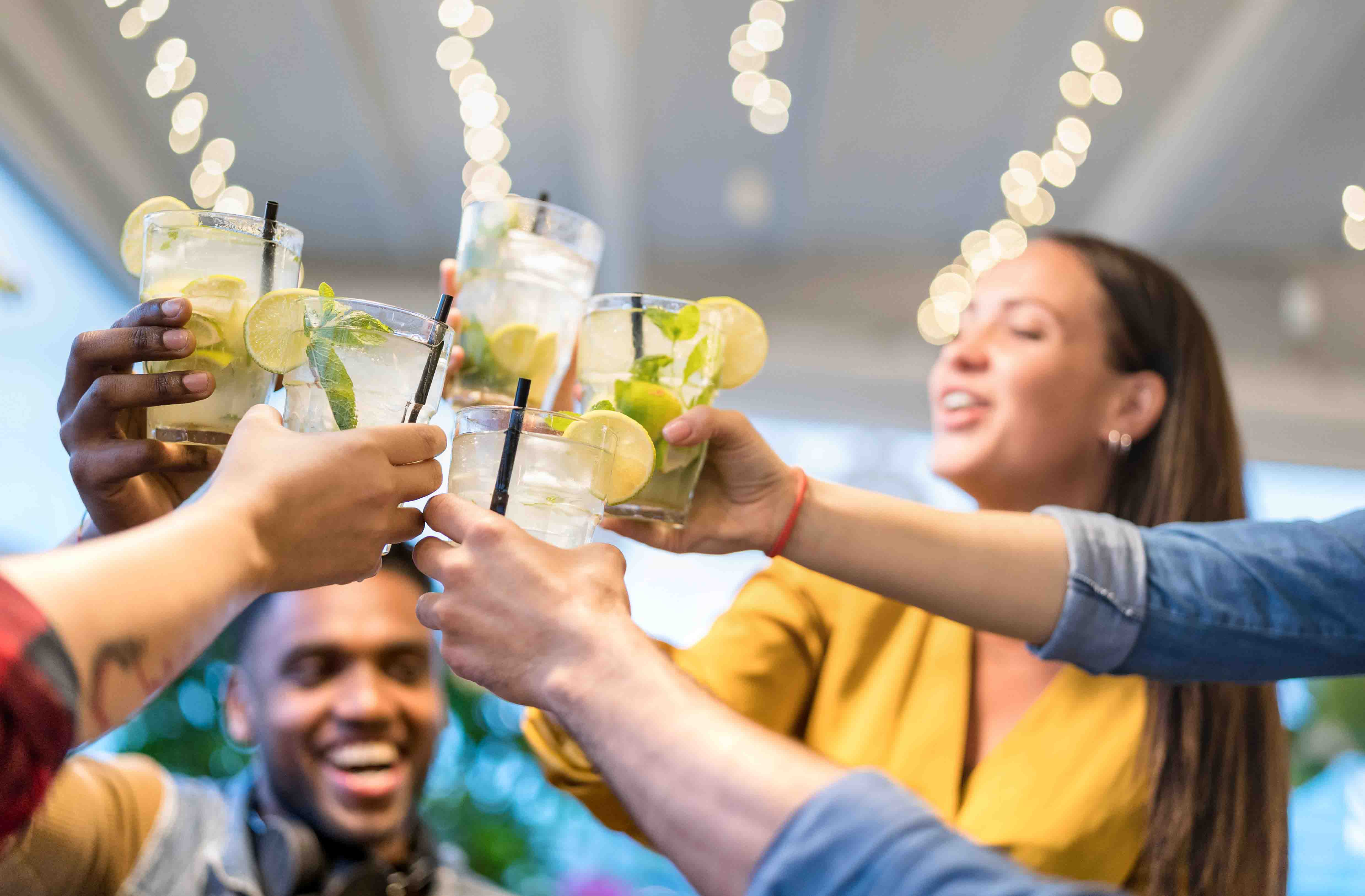 Group doing a cheers with drinks.