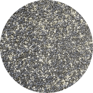 Close-up of gray feedlot micro premix with tiny particles, used in animal feed micro systems for optimal flow and handling