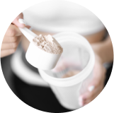 protein powder being poured into a cup