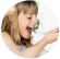 little girl eating a yogurt 