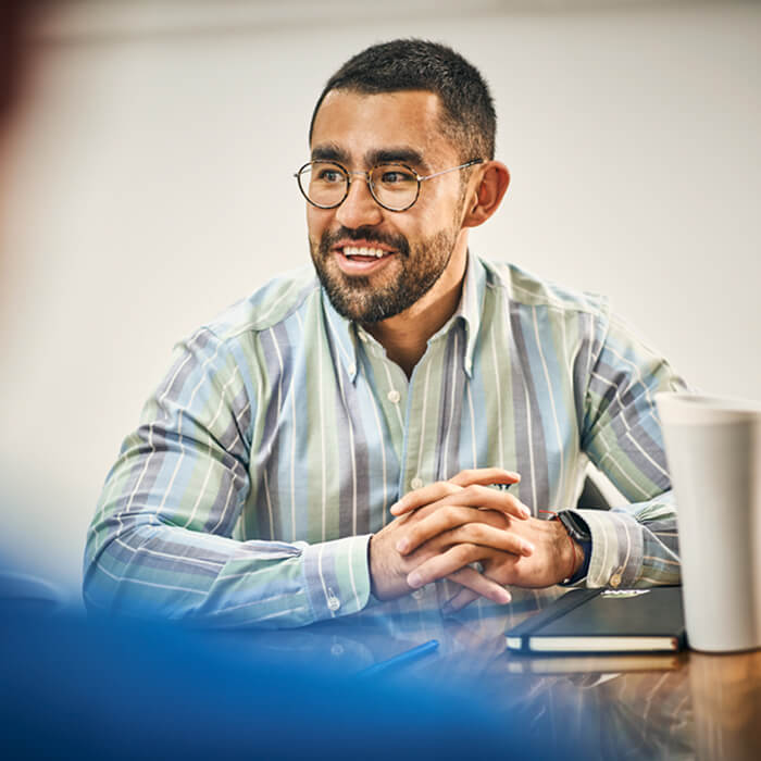 A man sitting at a conference room table